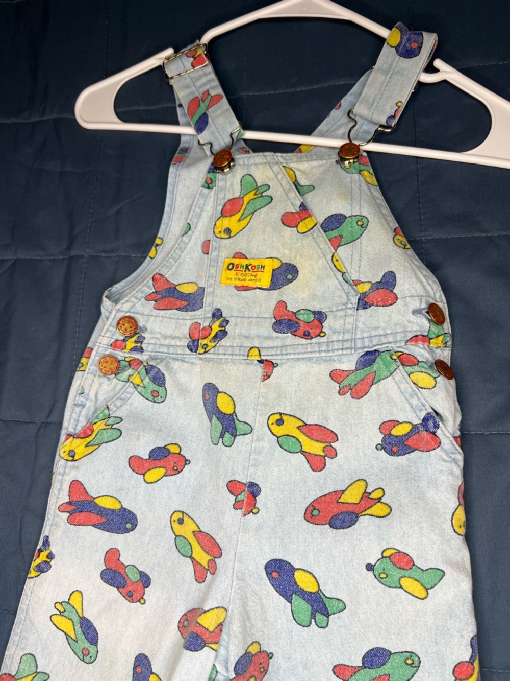 vintage OshKosh B'Gosh toddler overalls featuring an airplane print size 3t
